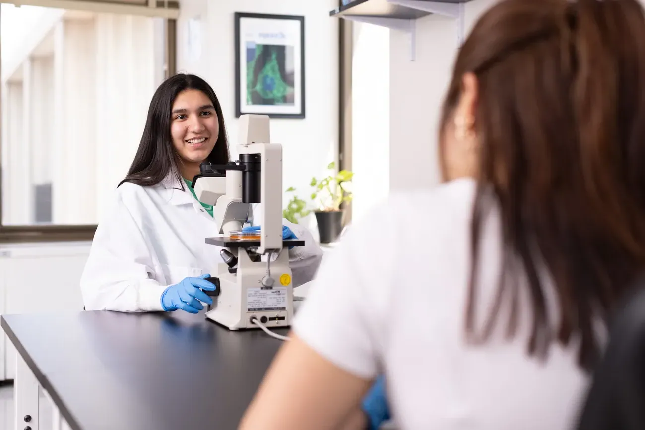 Research student working in laboratory.